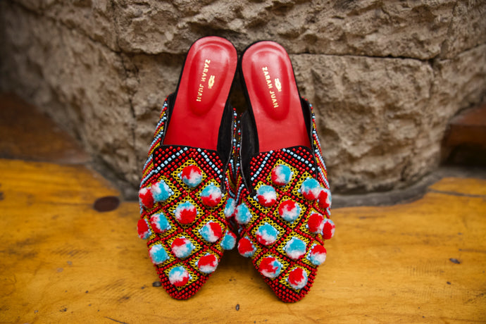 Batwing mules with pompoms