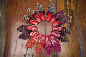 Batwing mules with pompoms